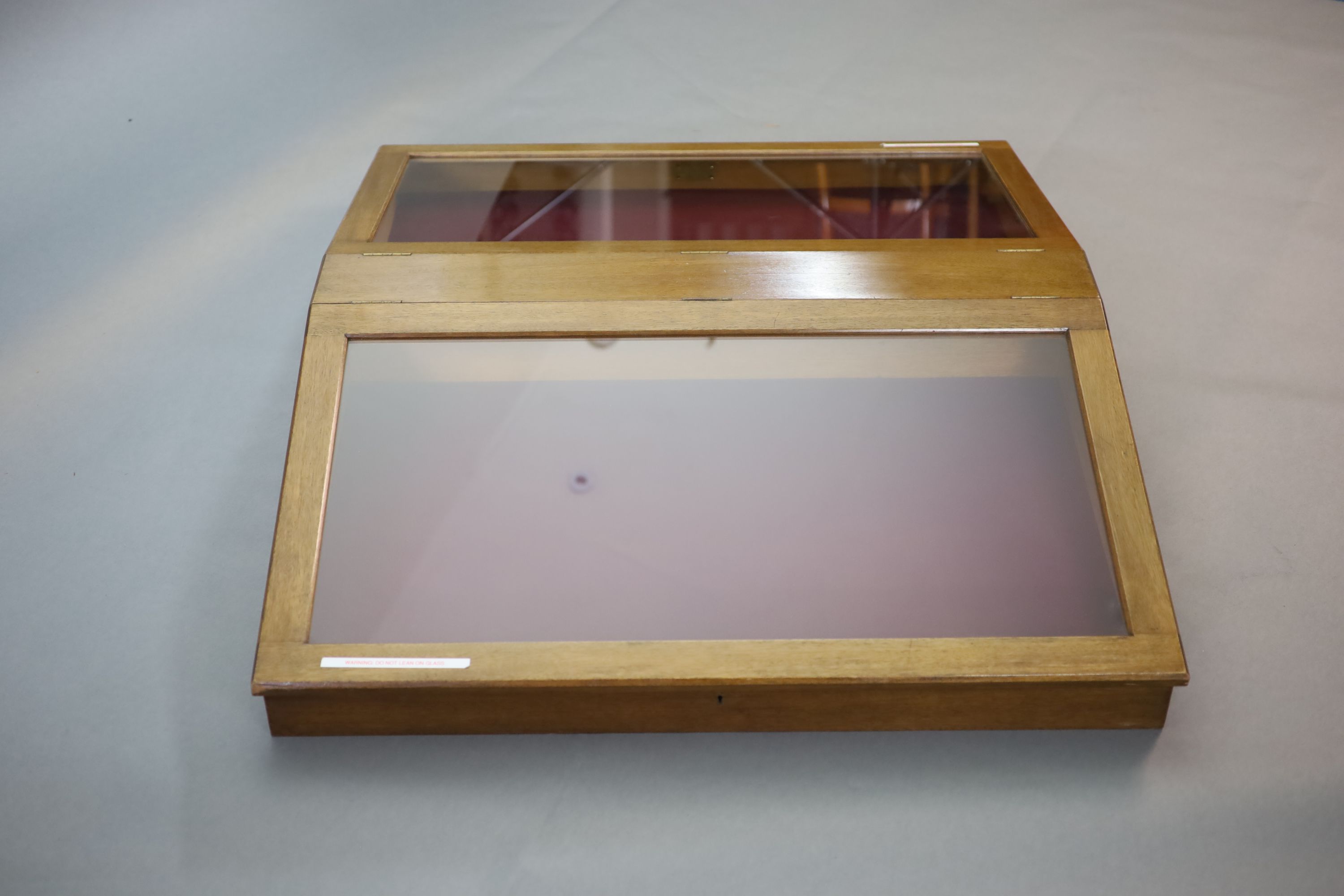 A 20th century teak table top double display case, from the Library of the Royal College of Surgeons, width 103cm depth 128cm height 108cm